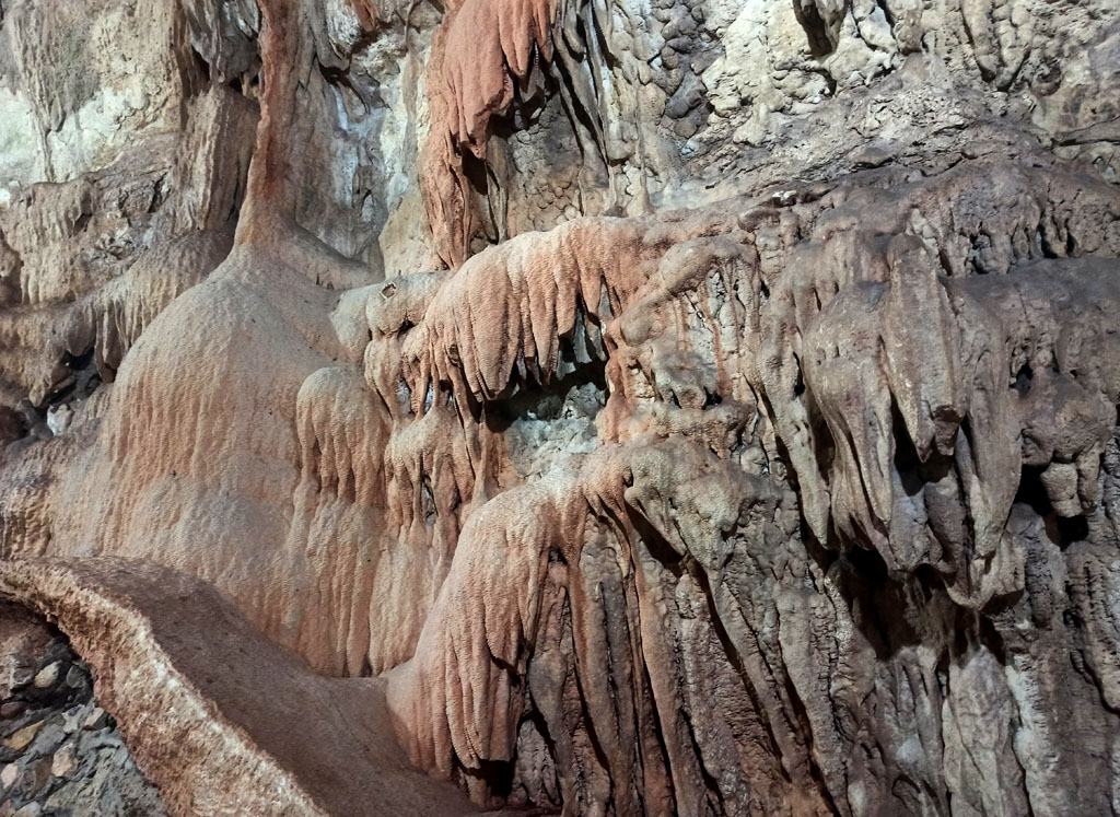 How to Get to Cenote Suytun: Discover the Easiest Way to Reach Yucatán’s Most Magical Cenote cenote suytun 2 Limestone stalactites and stalagmites formations in Cenote Suytun showing scale with swimmer in crystal clear freshwater
